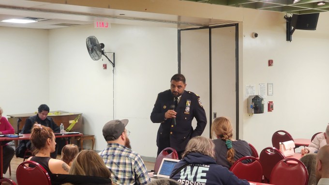 Captain Hameed Armani addresses his first community meeting as commander of the 108th Precinct. Photo: Shane O'Brien